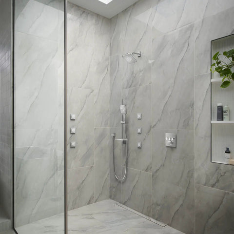 Modern bathroom with Euphoria Cube Shower Wall Union in Starlight Chrome, half-inch NPT female threads, geometric square design.