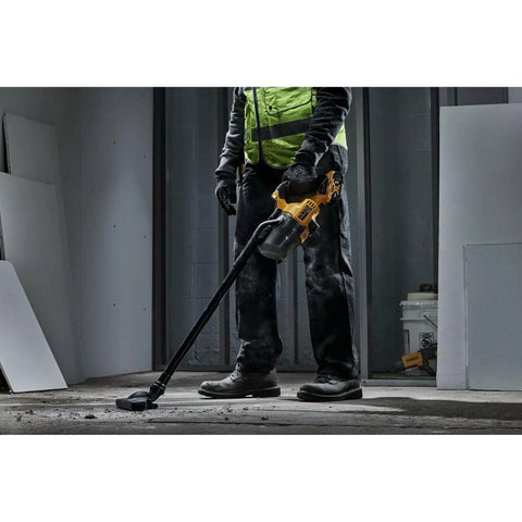 Person using Beast 20V Cordless Handheld Vacuum With HEPA Filter LED Light 46 CFM for dry debris on concrete floor in workshop