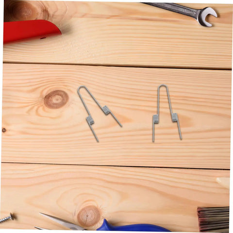 Upgrade Your Home With This Awesome 4pcs Stainless Steel Garbage Can Lid Spring Replacement Kit Featuring Dual Torsion Coils For Press Top Lids, High Elasticity, Stable Operation, And Durability For Easy Household Bin DIY Repair Jobs, four metal springs on wood