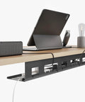 Under Desk Cable Management Tray 31.5 Inch Metal Cord Organizer mounted under wooden desk, organizing cables and power strips
