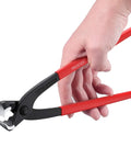 Hand holding a red-handled crimper tool from the Stepless Single-Ear Hose Clamp Pliers Kit With 304 Stainless Steel Pipe Clamps 200 Pcs 5.8-21mm Range.