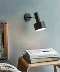 Modern Nordic Black Metal Wall Sconce Adjustable E26LED Spotlight above bedside table with books