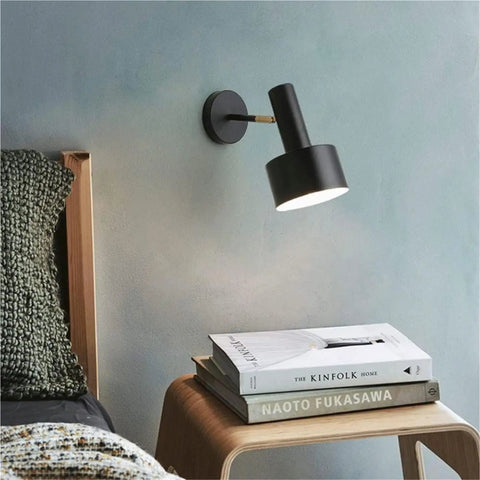 Modern Nordic Black Metal Wall Sconce Adjustable E26LED Spotlight above bedside table with books