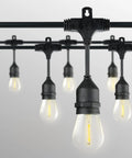 48 Ft Outdoor String Lights With 15 Waterproof LED E26 Bulbs Commercial Grade Patio Cafe Lighting For Backyard Ambience Durable Shatterproof Plastic Bulbs Built To Withstand Rain And Sun hang against a white background.