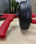 Heavy Duty 50ft Drain Auger With Drill Adapter For Kitchen Bath Utility Sinks Flexible Drum Snake For Quick Unblock Manual Or Powered Operation Includes Work Gloves And Storage Bag showcasing red ergonomic handle and black drum on table
