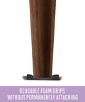 Round Two And Half Inch Reusable Furniture Sliders For Carpet Eight Pack Beige shown under table leg on carpet.