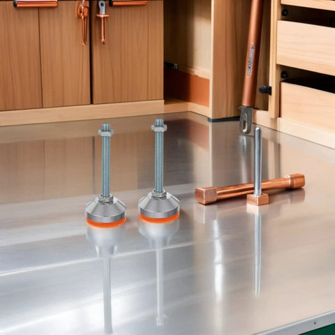 Heavy Duty Swivel Leveling Feet With GripLock Rubber Base And Easy Tune Bolts For Sturdy Workbenches And Garage Rigs D60x12mm Rock Solid Pack Of Two on a metal surface.
