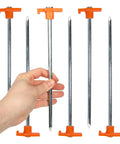 Beefy 10-Inch Steel Tent Stakes Heavy-Duty Ground Anchors 4-Pack for camping with corrosion-resistant finish in hand