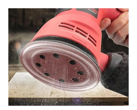 Image of a user operating a random orbital sander, showcasing the tool's hook loop base for 5 inch pads.