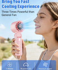 Turbo Handheld Fan 12800 RPM Ultra Portable 4 In 1 Mini Fan held by person for cooling outdoors