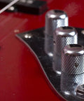 Close-up of knurled aluminum potentiometer knob 6mm shaft fits quarter inch pots rotary volume control knob on red guitar