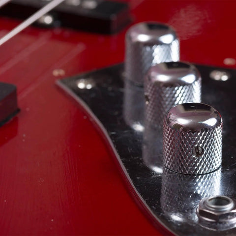 Close-up of knurled aluminum potentiometer knob 6mm shaft fits quarter inch pots rotary volume control knob on red guitar