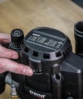 Close-up of the Beefy Dual-Mode Plunge Router 3-1/4 HP With 1/2 Inch Collet, showing speed settings and control knobs.