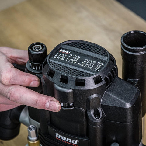 Close-up of the Beefy Dual-Mode Plunge Router 3-1/4 HP With 1/2 Inch Collet, showing speed settings and control knobs.