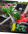 Person planting flowers with a Stainless Steel Garden Hoe Tool With Ergonomic Handle For Quick Weeding And Digging In Vegetable Gardens