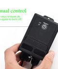 Manual control on Beefy Waterproof Wireless Relay Switch For Outdoor Lighting With Long Range RF Remote, shown in hand