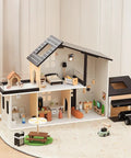 Wooden Dollhouse Garage Set With Workbench, Lawn Mower, Bicycle And Car For Kids, shown with accessories and furniture in playroom setting.