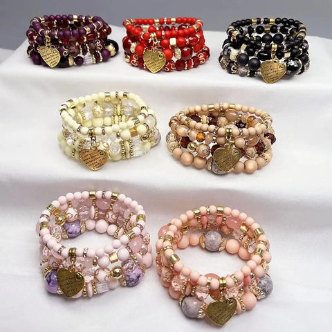 Various colored kandi bracelets made with 1.0mm stretchy beading cord for pony beads and DIY jewelry on display.