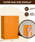 Orange kraft gift bag with handles, paper size display, 10.8x4.5x8 inches, part of Kraft Gift Bags With Handles Bulk Pack 24 Small Party Favor Bags In 6 Colors, 5.8 By 3.2 By 8.25 Inches, Great For Kids Birthday, Baby Shower, Weddings, Crafts And Classroom Events