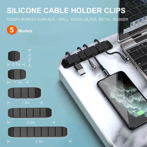 Silicone cable holder clips in use on desk showing cable management for neat arrangement next to a phone and laptop