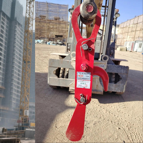 3 Ton Automatic Decoupling Lifting Hook For Forklifts in thickened alloy steel, shown attached to forklift, construction site in background.