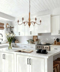 Six Light Distressed White French Country Candle Chandelier With Cozy Vintage Vibe For Living Room Dining Room Bedroom 24 Inch Wide Rustic Ceiling Fixture in kitchen setting