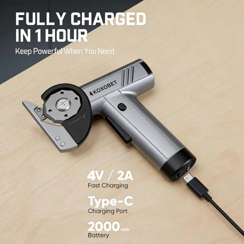 Cordless cutting tool with silver metal body, angled side view; front rotary blade guard and USB-C charging port