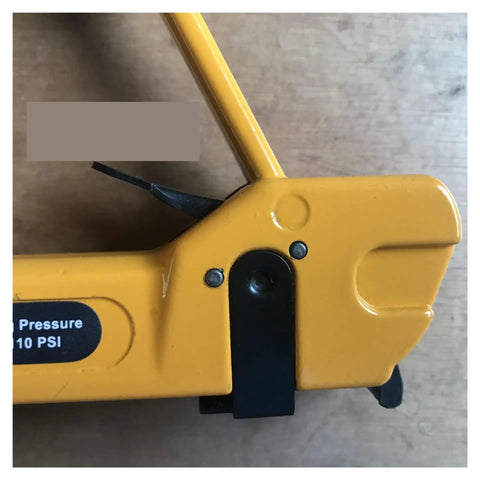 Close-up of Professional Pneumatic Nail Gun compatible with 7116 staples showing yellow body and grip lever.