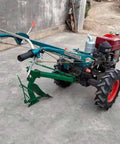 Compact Two Wheel Walk Behind Power Tiller For Gardening And Small Farms with tillage attachment on concrete surface.
