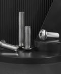 22 Pack 3/8 16 X 1/2 In Button Head Socket Cap Bolts Made From Badass 304 Stainless Steel on a black display surface.