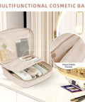 Multifunctional cream cosmetic bag with detachable pocket, open to display organized skincare products and makeup items on table.