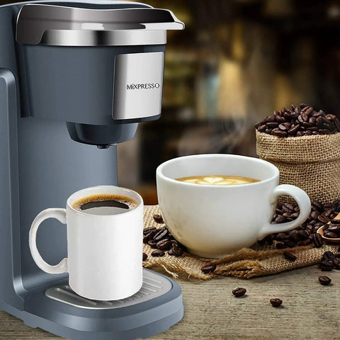 One Touch Single Cup Coffee Brewer With Quick Brew, 12 Oz Grey Coffee Maker, steaming cups next to machine