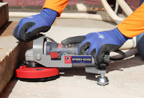 Worker using Turbo Concrete Grinding Cup Wheel 5 Inch 20 Segment With Threaded Arbor for edging concrete surface outdoors