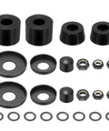Premium Skateboard Bushings And Truck Rebuild Kit With Hella Tough Washers And Pivot Cups Set In Durable Polyurethane Black for longboards, featuring bushings and hardware.