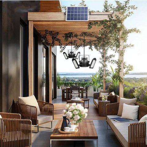 Premium Solar Pendant Light With Remote Control And Sixty Leds illuminates a stylish patio with modern chairs and a solar panel.