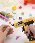 Cordless Hot Glue Gun Kit Powered By A 20V Battery Includes 20 Glue Sticks 0.43 Inch And Insulated Copper Nozzle in use on phone case