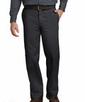 Heavy Duty Mens Straight Leg Work Pants Crafted From Tough Poly Cotton Blend Features Wrinkle Resistant Black Uniform Trousers Built Different For The Daily Grind And Size 29W By 30L worn by a man standing with hands in pockets.