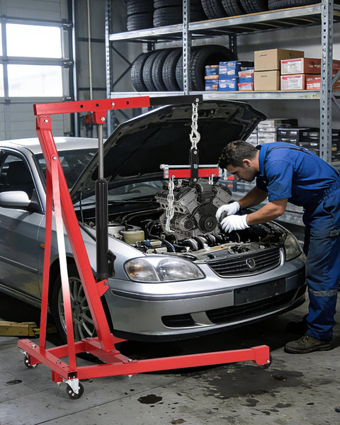 Mechanic using Heavy Duty Hydraulic Engine Hoist With Lever 1.5 Ton Capacity 3000 Lbs Shop Crane in garage