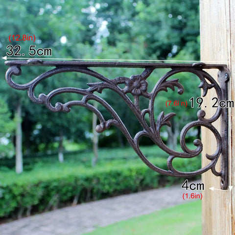 Premium Heavy Duty Cast Iron Wall Mount Shelf Brackets For Floating Shelves Rustic Industrial Triangle Corner Supports With Screws Built Like A Tank Two Pack side view in garden.