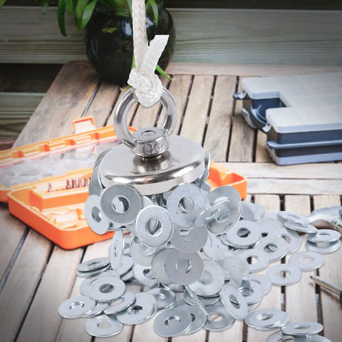 Powerful 150 Lb Neodymium Magnetic Lifting Set attracting metal washers, displayed on a wooden table.