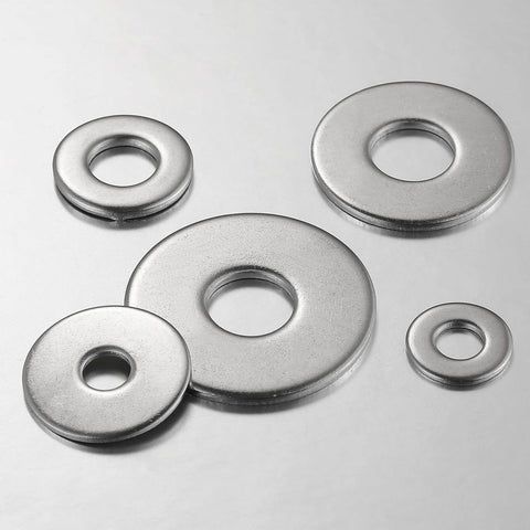 Overhead view of five 304 stainless steel flat washers in assorted sizes for screws and bolts.