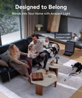 Family in living room with Flow 2 Robot Vacuum And Mop Combo With 31000 Pa Suction, resting near self-emptying base.