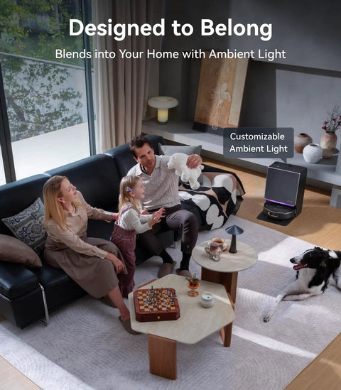 Family in living room with Flow 2 Robot Vacuum And Mop Combo With 31000 Pa Suction, resting near self-emptying base.