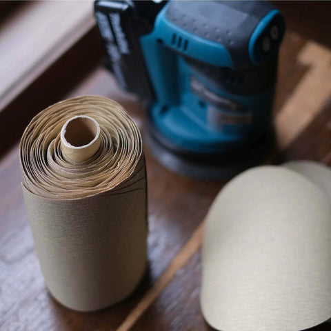 80 Grit Pro Grade Quick Change Sanding Discs Roll 6 Inch Round Aluminum Oxide Sticky Back Sandpaper shown with sander