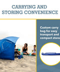 Beach scene with UPF 50 Plus Go-To Sun And Rain Canopy Umbrella For Beach, Sports, And Camping, showing carrying bag for portability.