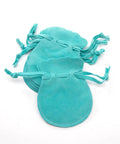 60 Pack Small Velvet Jewelry Pouches With Drawstrings For Gifts, Rings, Earrings, Watches And Keepsakes displayed in turquoise color.