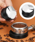 All In One 7 Piece Espresso Accessories Kit For Home Baristas Includes 54mm Espresso Tamper in use with coffee beans close-up