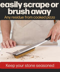 Person using 2 In 1 Pizza Oven Brush And Scraper For Quick Stone Cleaning With Stainless Steel Head, Dual Purpose Outdoor Oven Cleaner