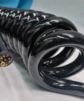 Super Flexible Retractable Spiral Coil Cord With Hella Tough 20AWG 18 Core Spring Cable Expanding Up To Fifteen Meters close-up showing coiled black wire.