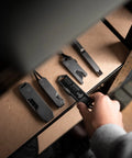 Hand picking up Titanium EDC Wrench For Everyday Carry With One Handed Operation Removable Pocket Clip Paracord Lanyard And Key Ring Universal 25 Size SAE And Metric Wrench Set In Silver from shelf